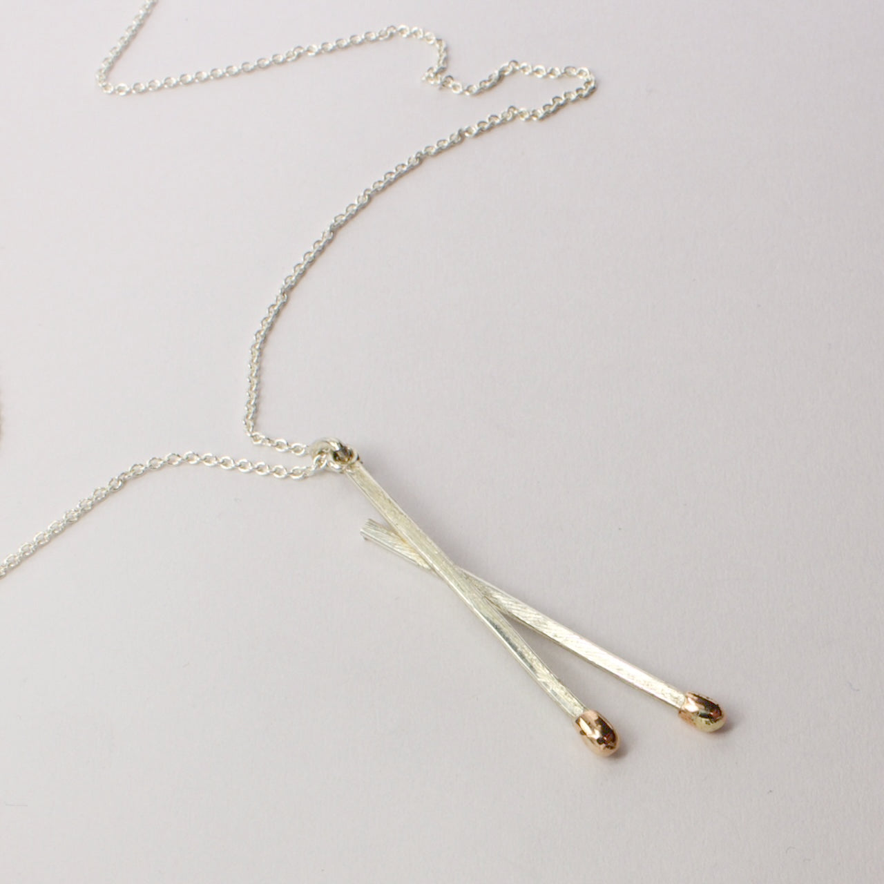 DM162C: Live double matchstick pendant