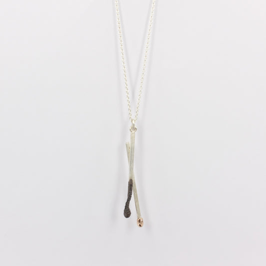 DM322C: Burnt and live matchstick pendant, large