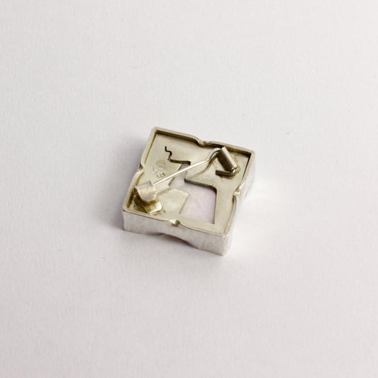 DM825B: Mother of Pearl lightning bolt brooch