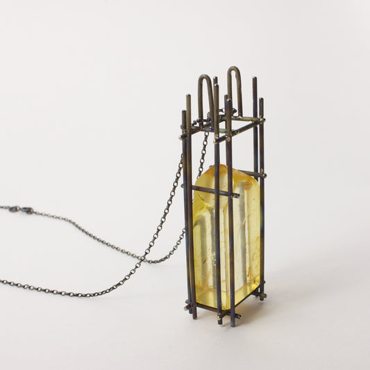 NA158: Kauri gum and titanium pendant
