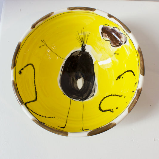 PH080C: Medium bowl with figure on yellow