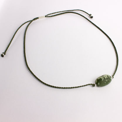 ACT501: Speckled argilite pendant on cord
