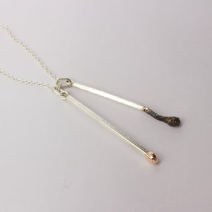 DM284C: Burnt and live loose matchstick pendant