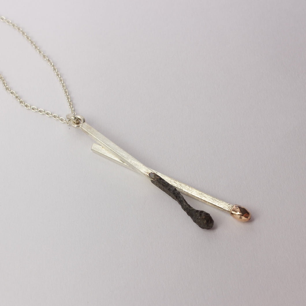 DM322C: Burnt and live matchstick pendant, large