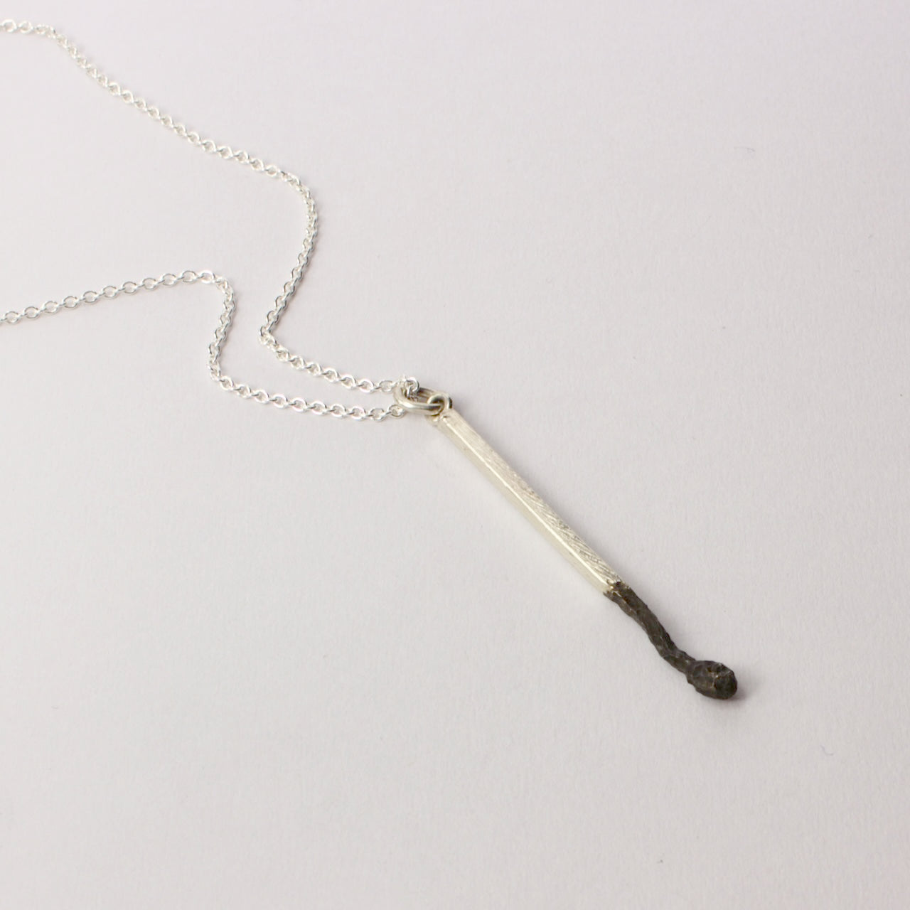 DM387C: Burnt matchstick pendant
