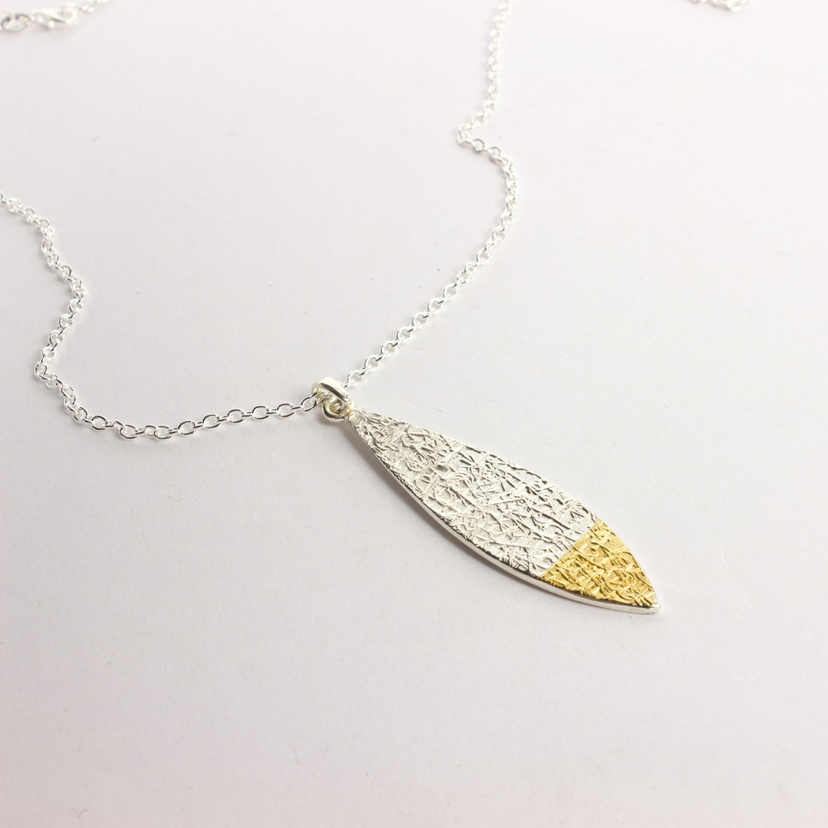 DM425C: Text-ure leaf pendant