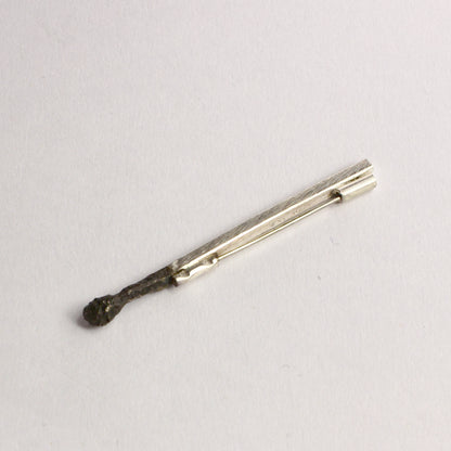DM822B: Burnt matchstick brooch