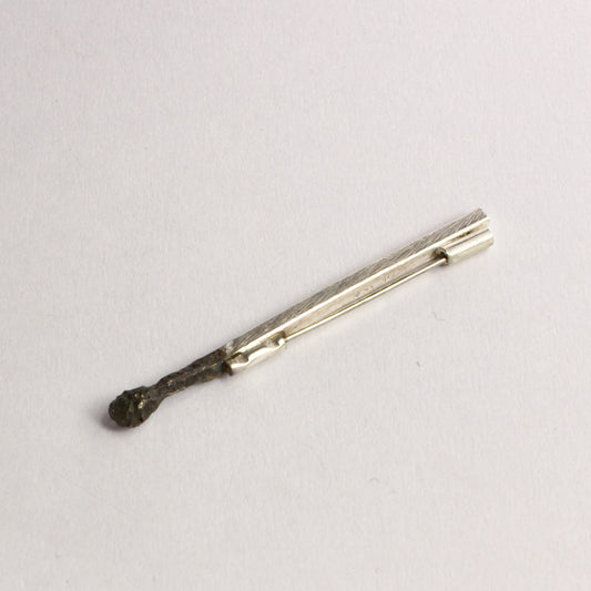 DM822B: Burnt matchstick brooch