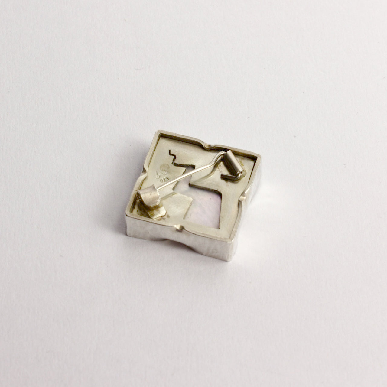 DM825B: Mother of Pearl lightning bolt brooch