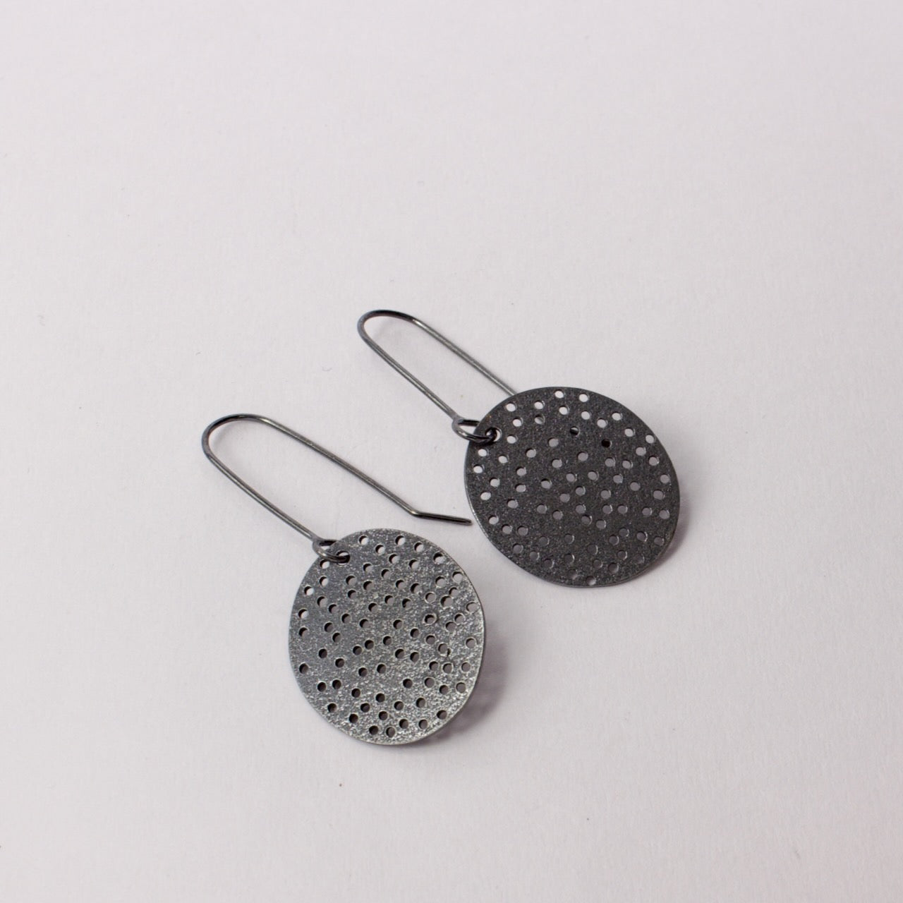 FS313: Holey disc earrings - oxidised