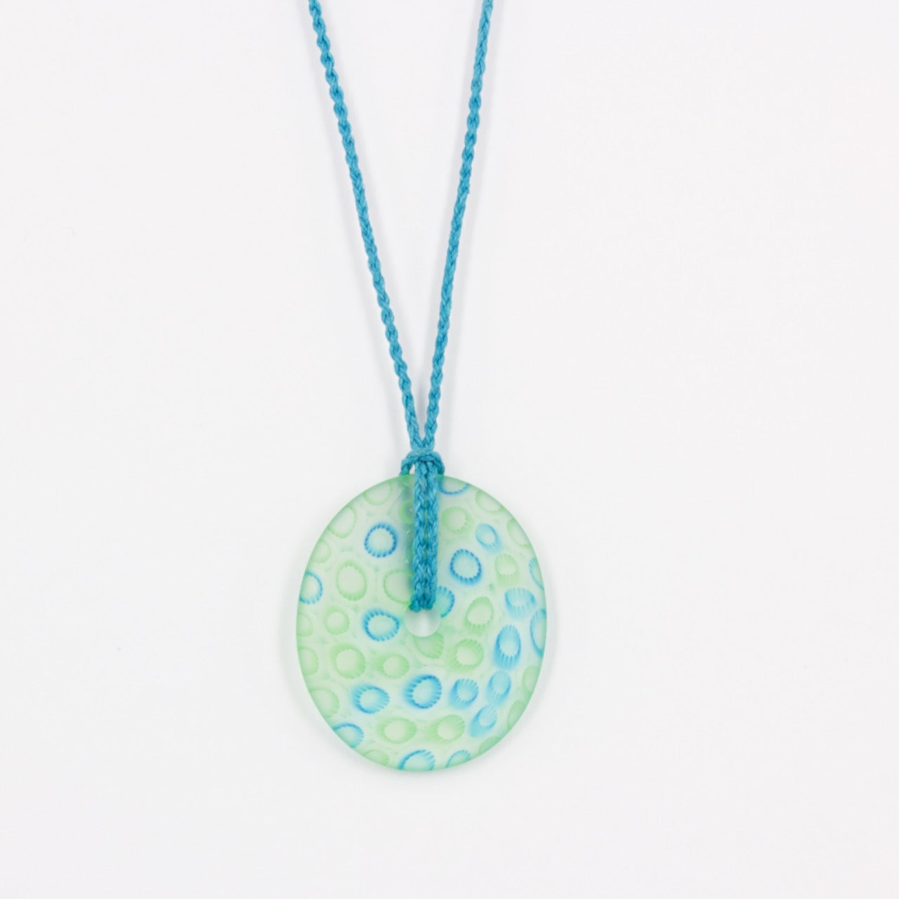 GSM21: Carved ellipse pendant