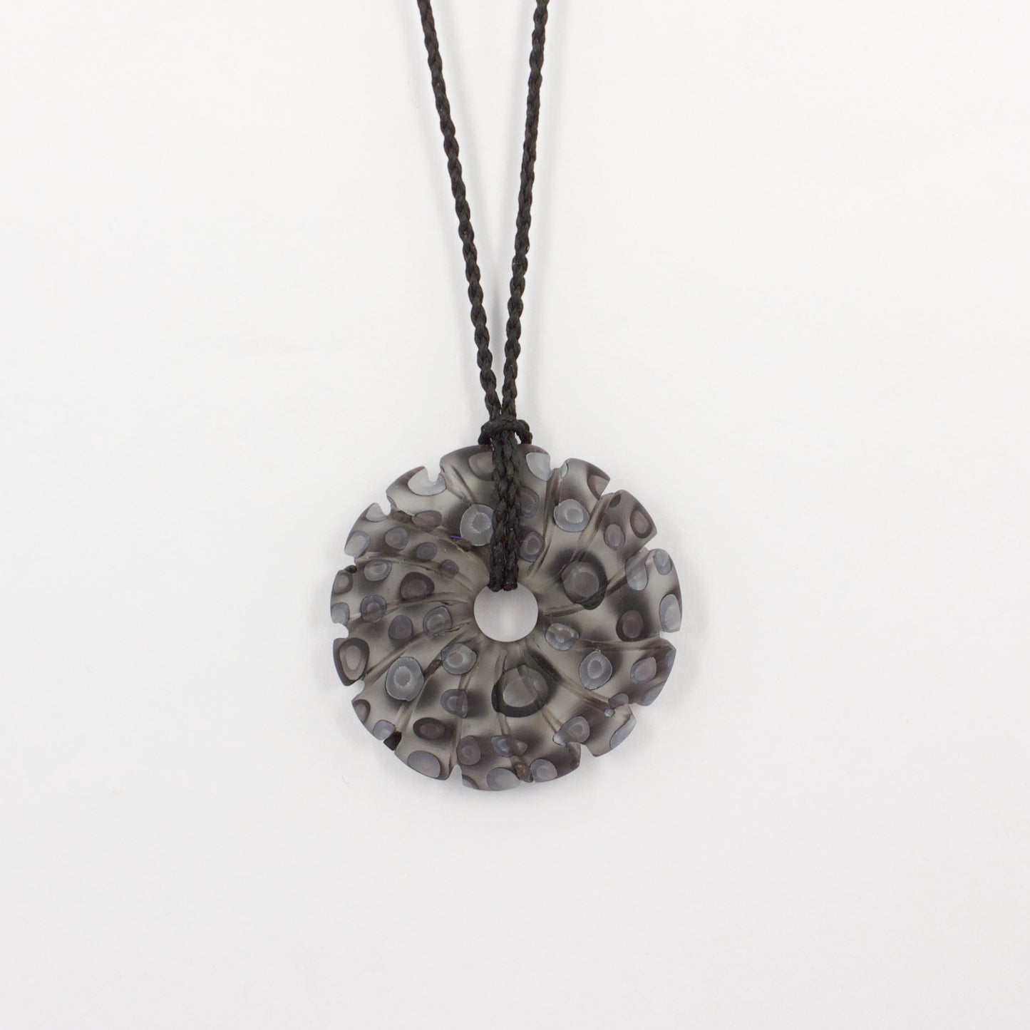GSM31: Carved shell pendant - black and white