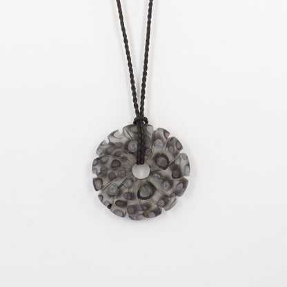 GSM31: Carved shell pendant - black and white