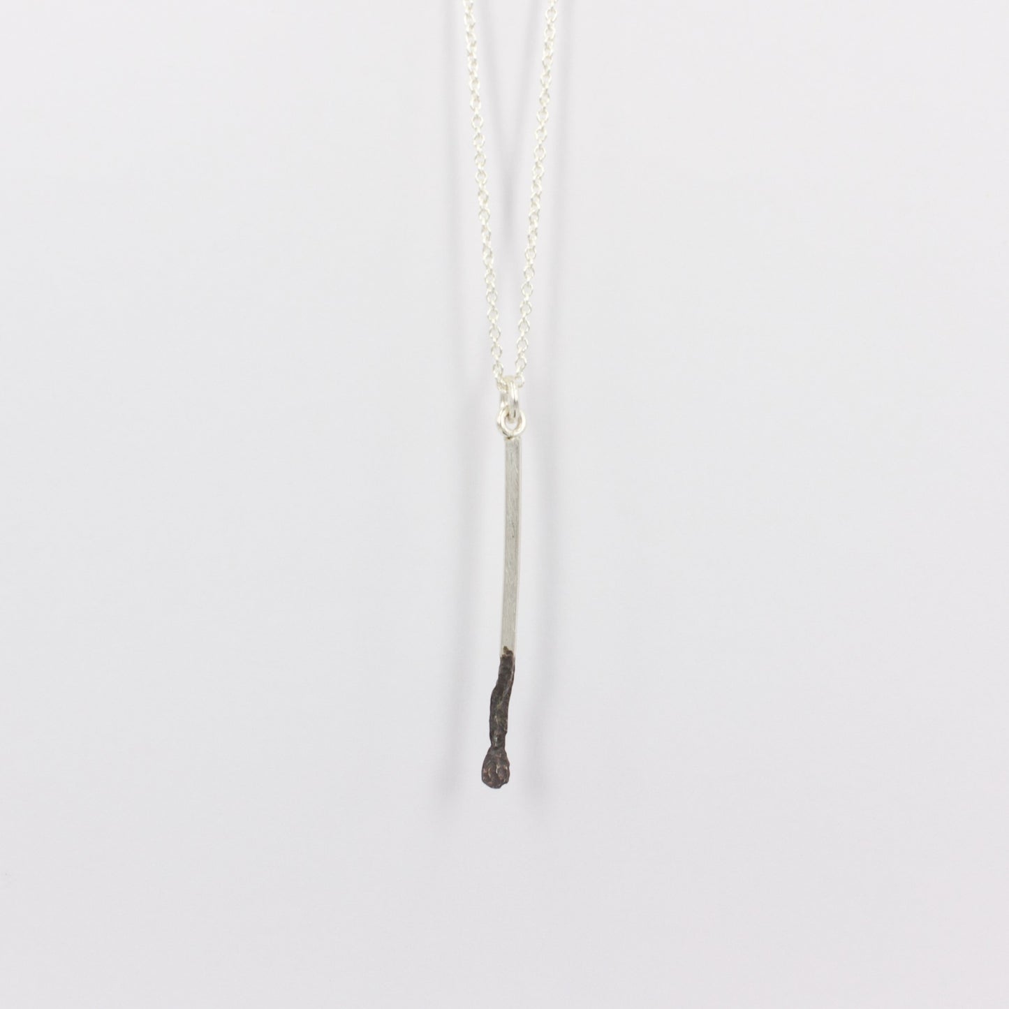 DM269C: Burnt matchstick pendant