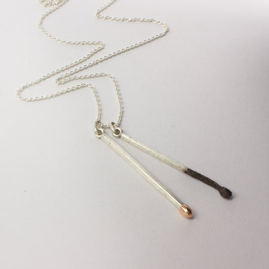 DM268C: Burnt and live matchstick pendant