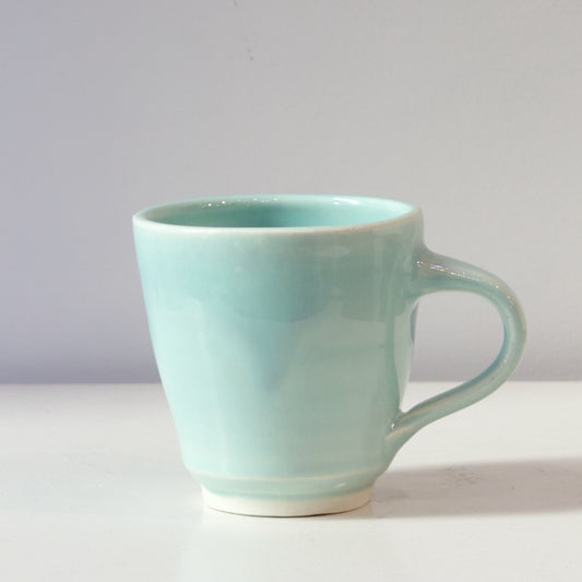 JLA: Pale blue mugs