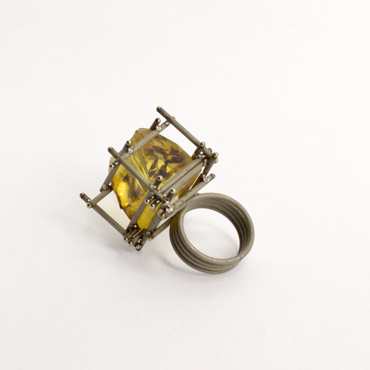 NA129: New Zealand amber and titanium ring