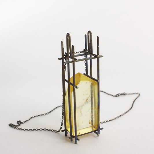 NA158: Kauri gum and titanium pendant