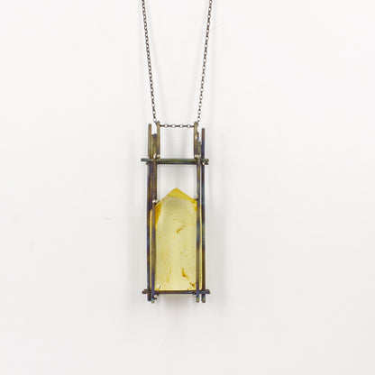 NA158: Kauri gum and titanium pendant