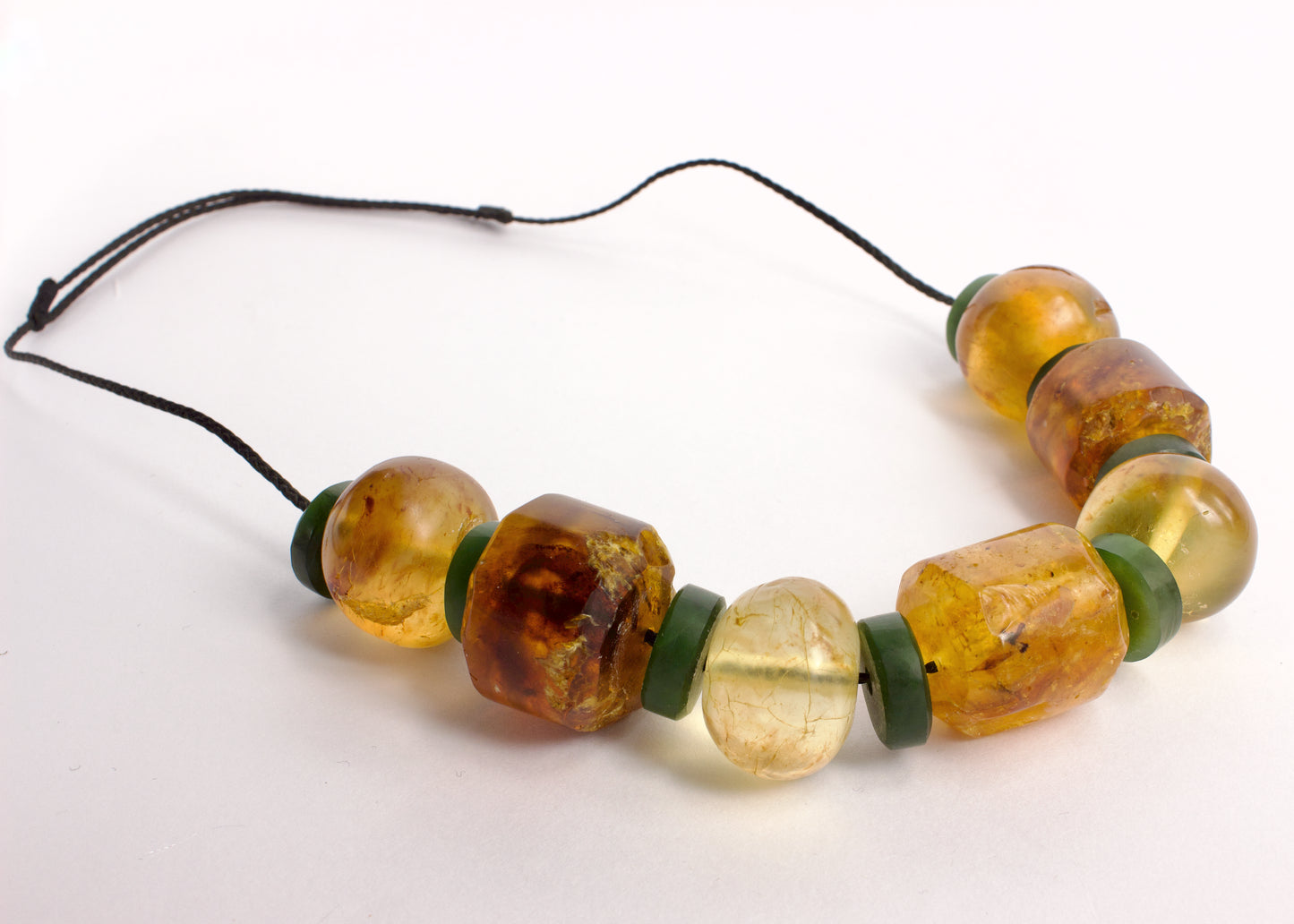 NA95: Kauri gum and pounamu bead necklace