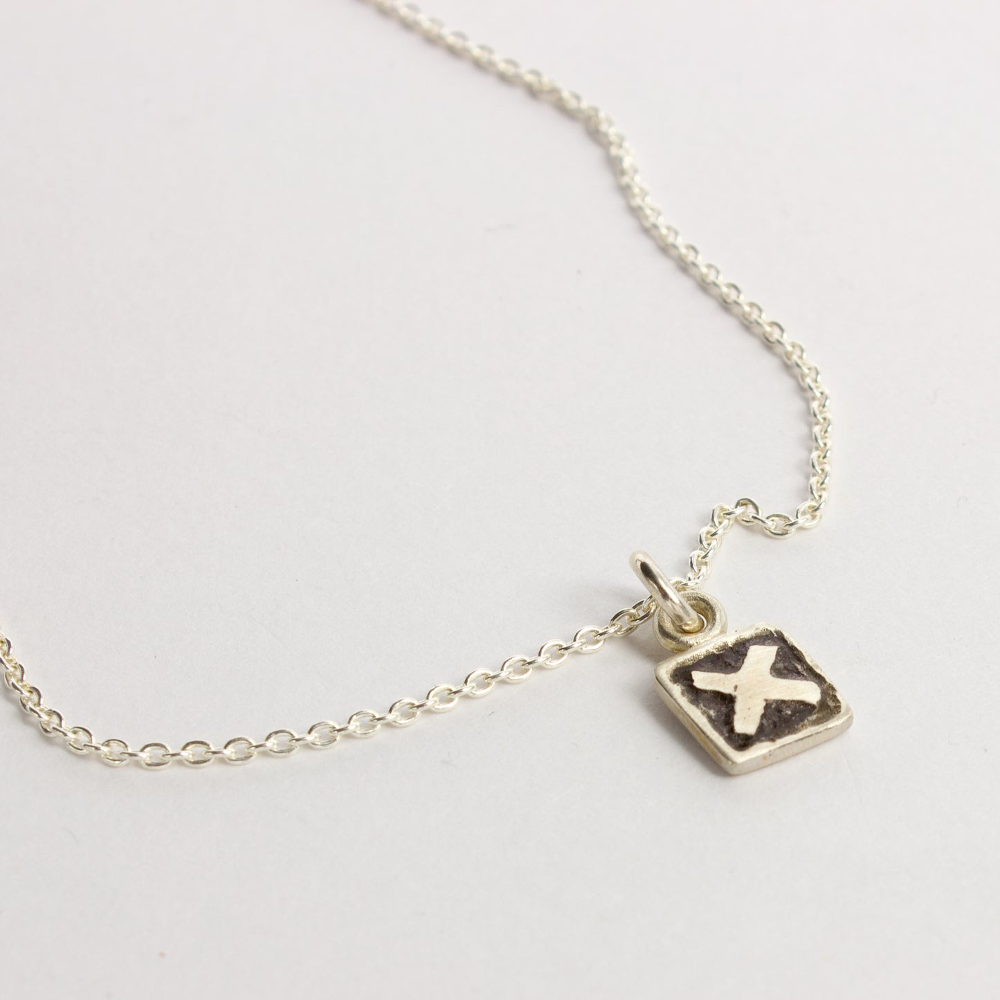 JMU129: X tile pendant