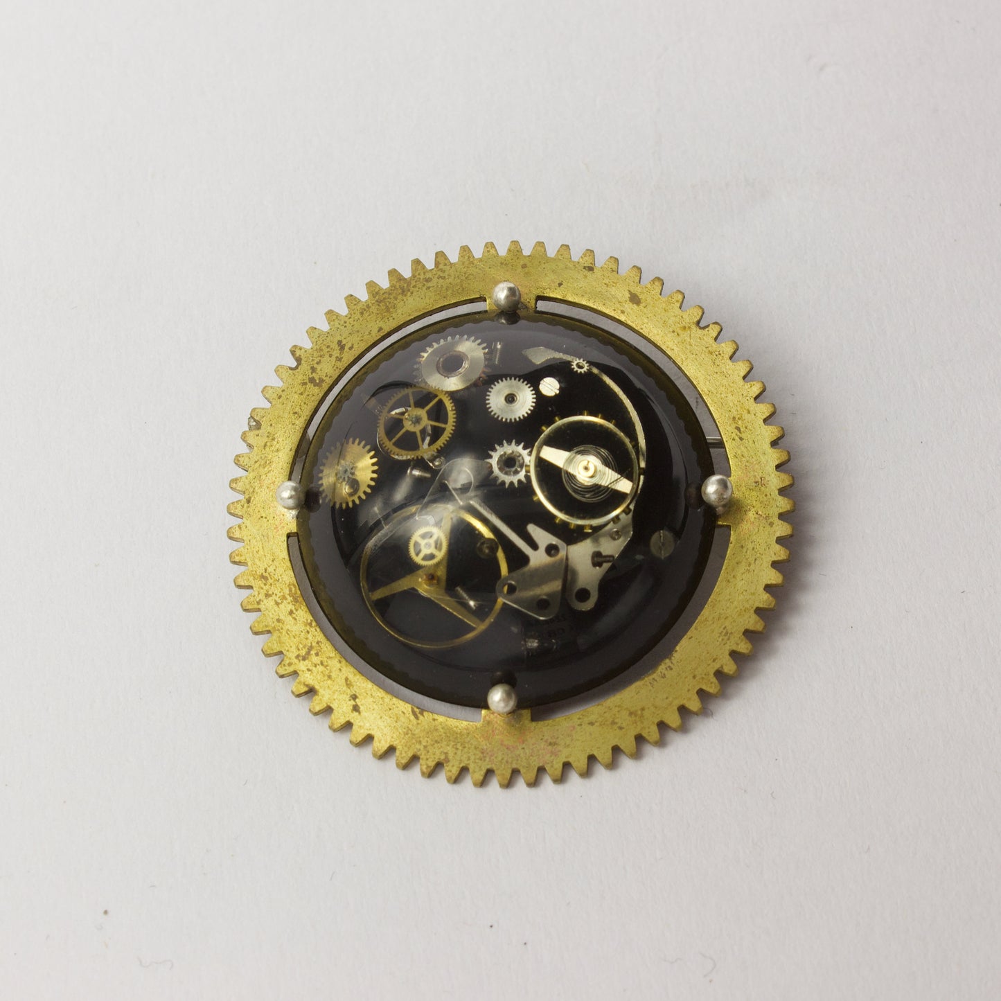 JA78: Cog brooch