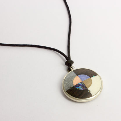 JA98: Double sided starburst pendant