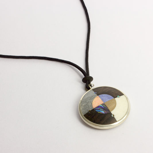 JA98: Double sided starburst pendant