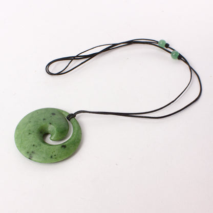 KAJ190: Koru disc pendant