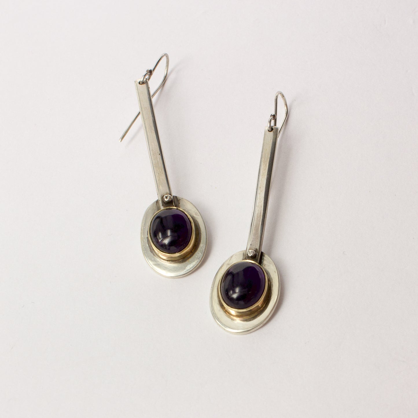 NG90: Oval amethyst lollipop earrings with gold bezel