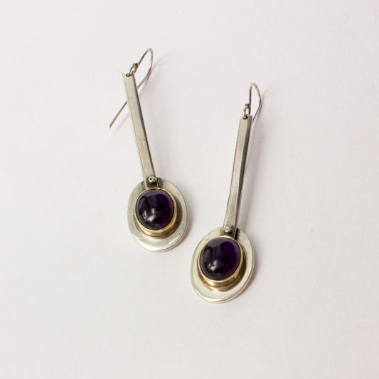 NG90: Oval amethyst lollipop earrings with gold bezel