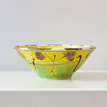 PH080C: Medium bowl with figure on yellow