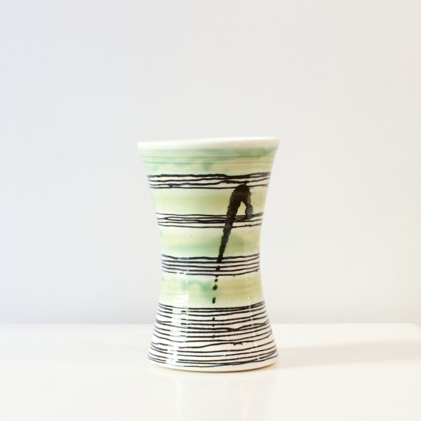 PH135B: Black and green vase