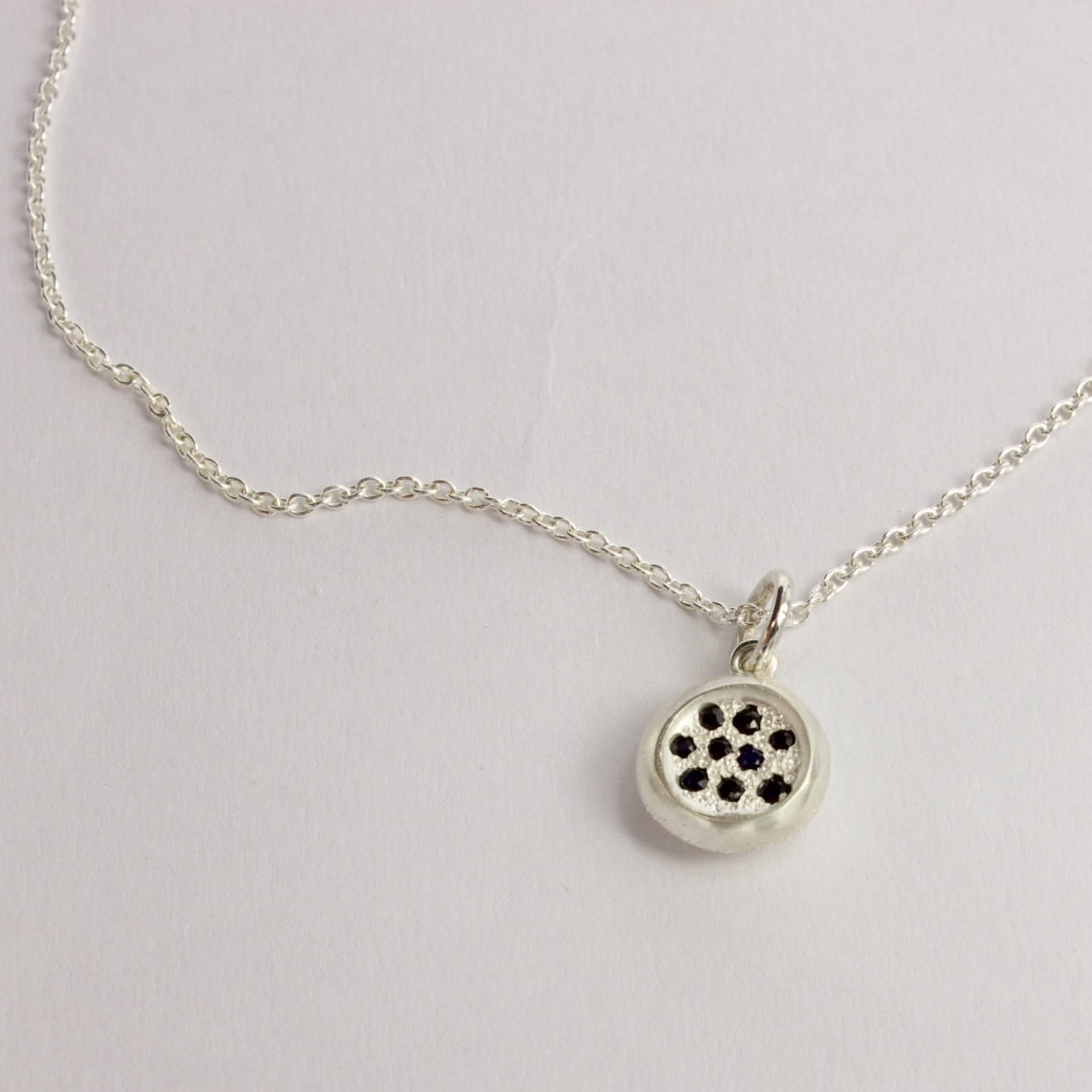 RMO62: Rock pool sapphire pendant