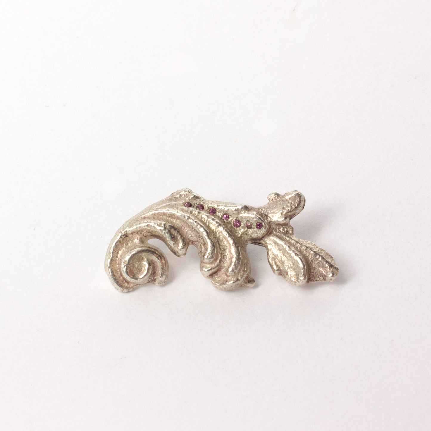 VM120: Sand cast scroll brooch