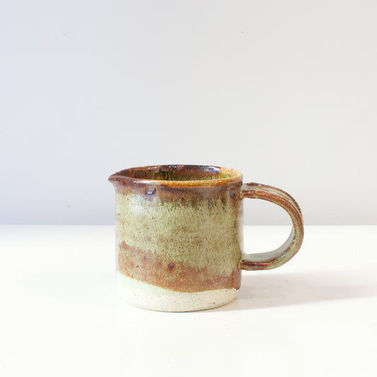 HP117: Brown and green glazed jug