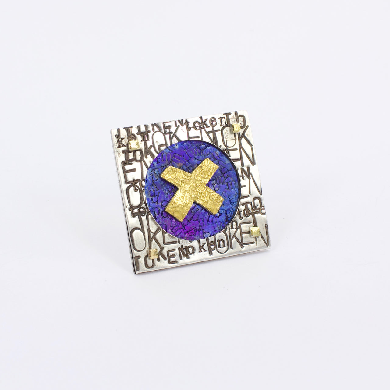 DM672A: Token politics brooch