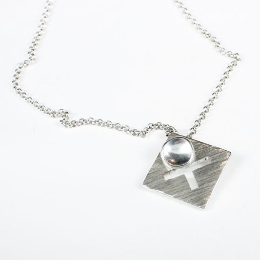 DH121: Cross and disc pendant