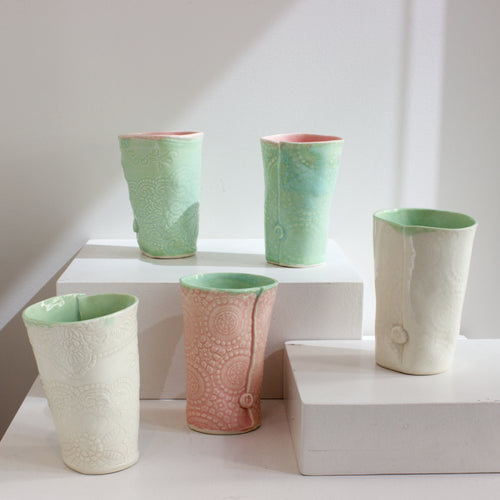 NML: Embossed beakers
